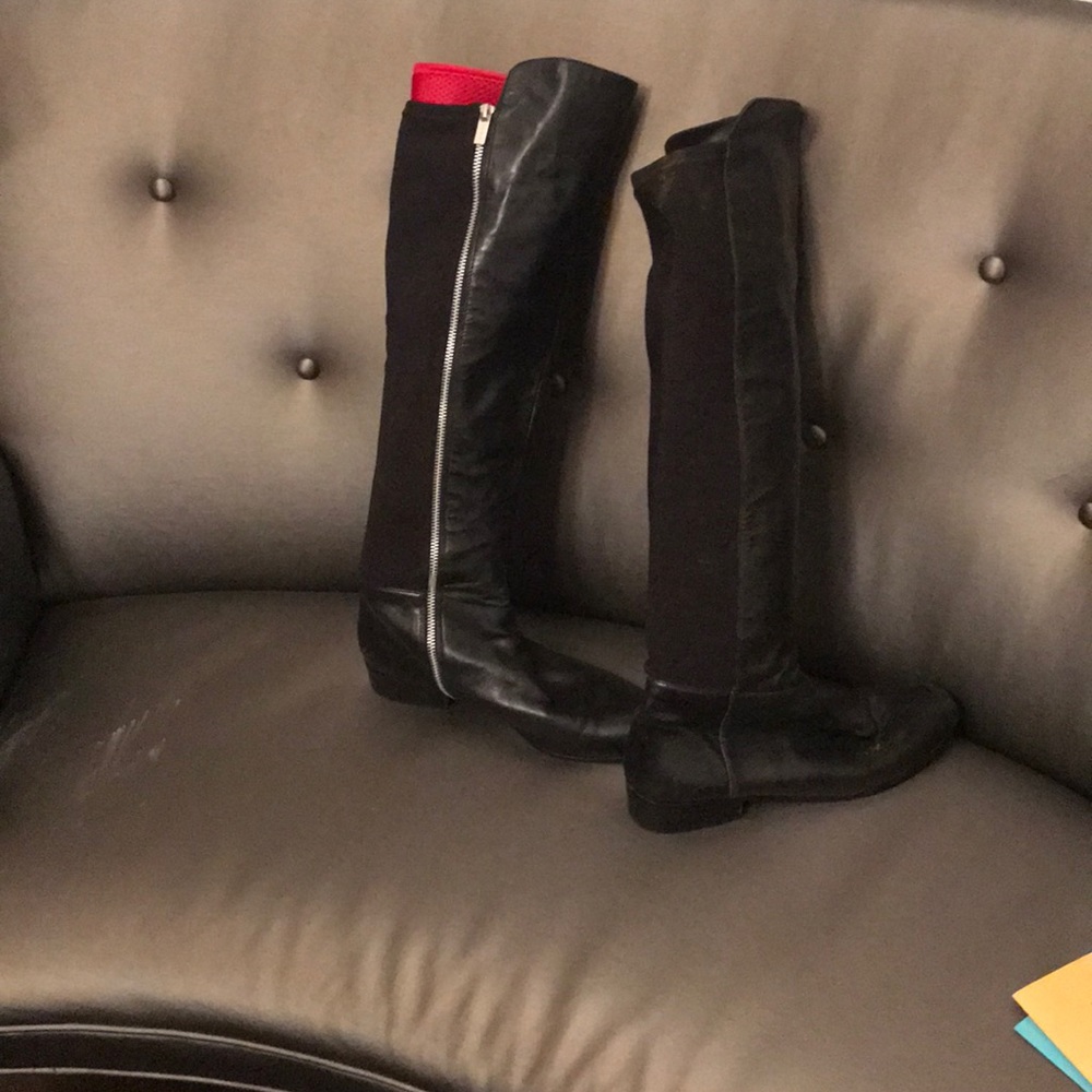 Knee high leather and fabric boots.